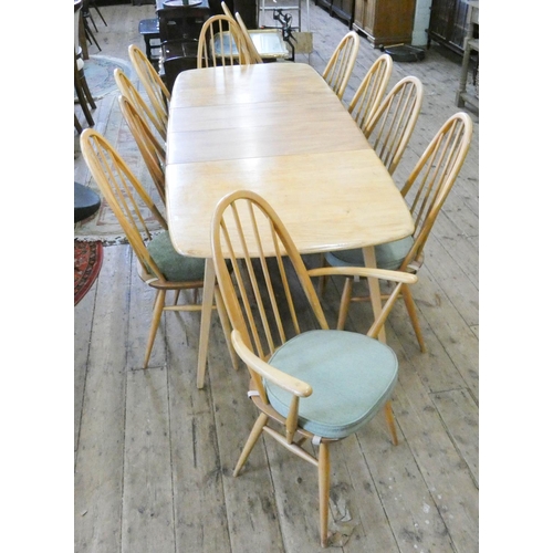 115 - An Ercol light elm extending dining table with two centre leaves, 7'6 x 3' with leaves in together w... 