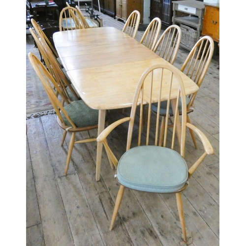 115 - An Ercol light elm extending dining table with two centre leaves, 7'6 x 3' with leaves in together w... 