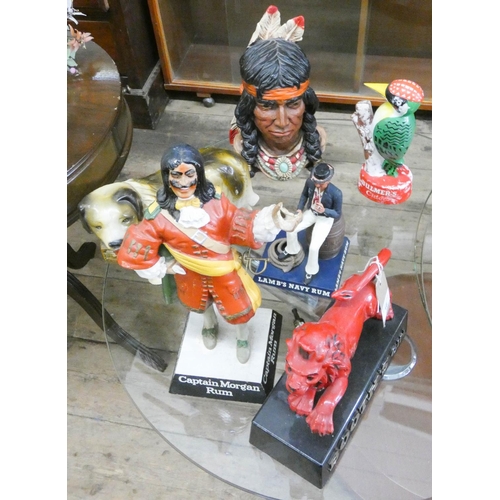 16 - Four various pub advertising figures, a native Indian figure and a dog figure