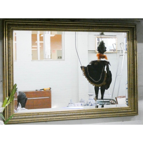 3 - A bevelled wall mirror in gilt frame