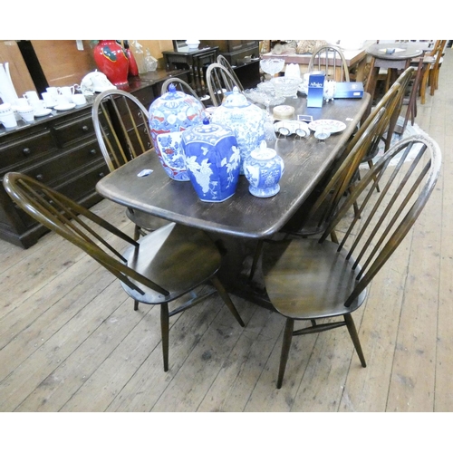 82 - An Ercol oak refectory style dining table, 6' x 34