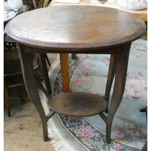 83 - A tall two tier oval oak occasional table