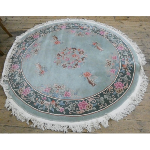 87 - A large circular floral embossed Chinese rug