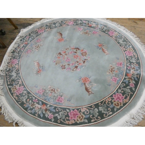 87 - A large circular floral embossed Chinese rug