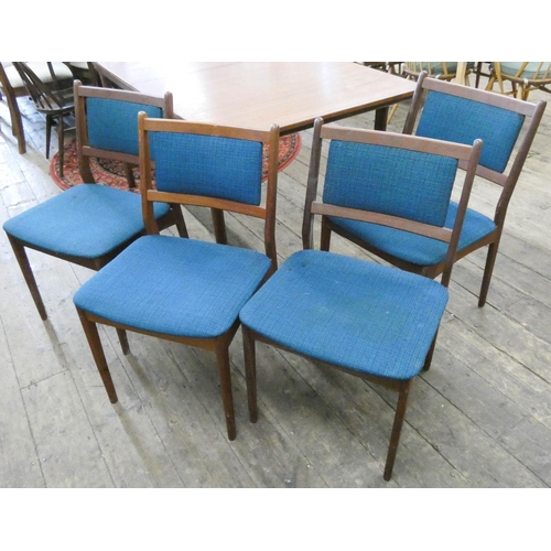 94 - A set of four 1970's teak framed dining room chairs with blue up[holstered seats and backs