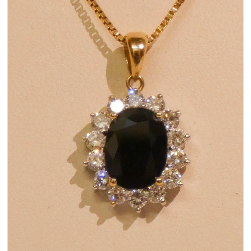 646 - Large modern 18ct gold sapphire and diamond oval cluster pendant on 18ct gold chain. With purchase r... 