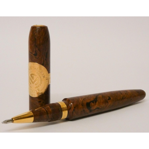 586 - Franck Muller cigar rollerball pen, with 18ct gold trim over a wood effect case.