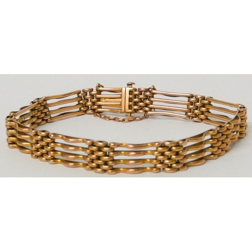 610 - A 9ct rose gold gate bracelet with concealed box fastening and safety chain. 14.2 grams