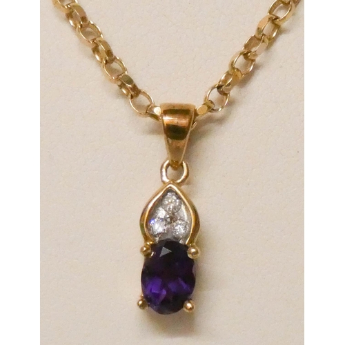 624 - An amethyst and diamond pendant on 9ct yellow gold chain.