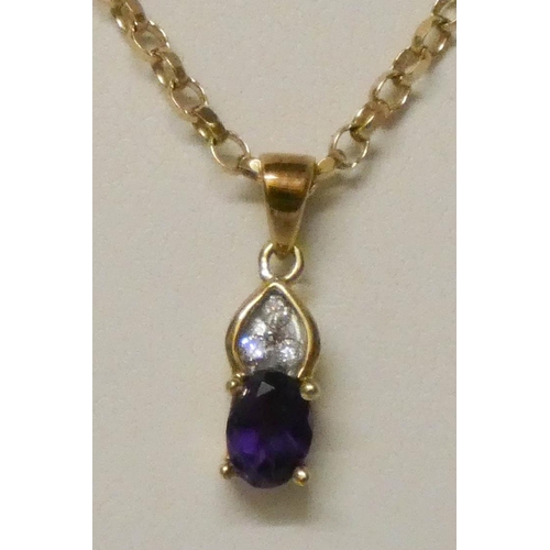 624 - An amethyst and diamond pendant on 9ct yellow gold chain.