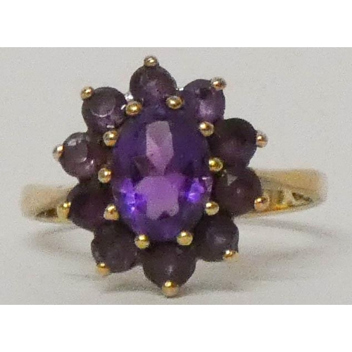 626 - An amethyst cluster ring, on 9ct gold shank, ring size P