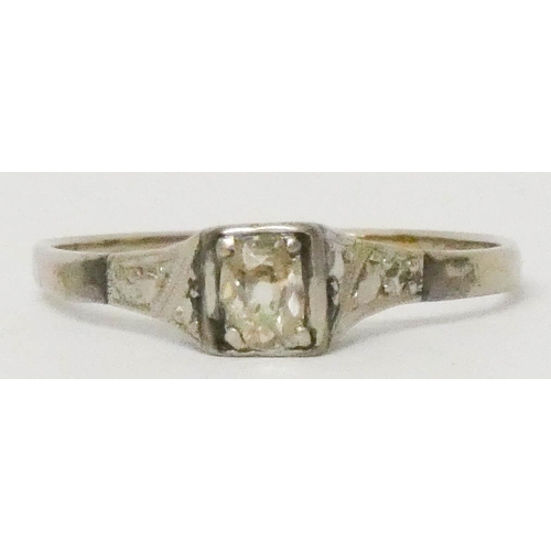 628 - An Art Deco single stone diamond ring, unmarked white metal shank. Size T