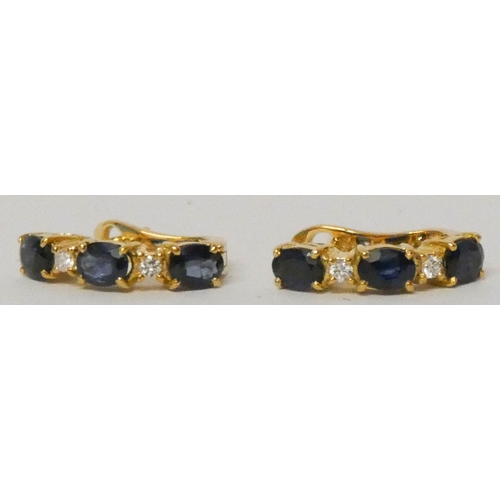 635 - A pair of modern 18ct yellow gold sapphire and diamond half hoop earrings, with post and safety clas... 