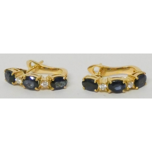 635 - A pair of modern 18ct yellow gold sapphire and diamond half hoop earrings, with post and safety clas... 