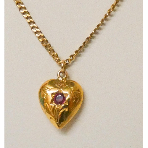 666 - A vintage heart shaped pendant set with a ruby, on 9ct gold chain, gross weight 12.4 grams