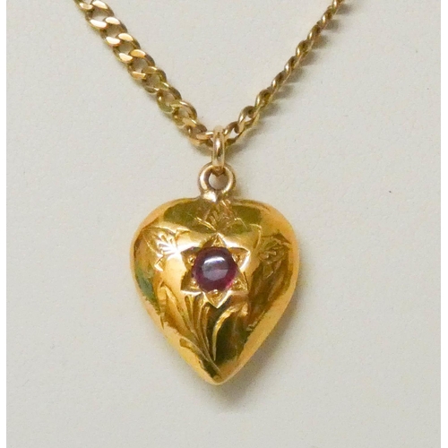 666 - A vintage heart shaped pendant set with a ruby, on 9ct gold chain, gross weight 12.4 grams