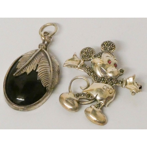 682 - A silver and marcasite Mickey Mouse brooch and a silver and onyx oval pendant