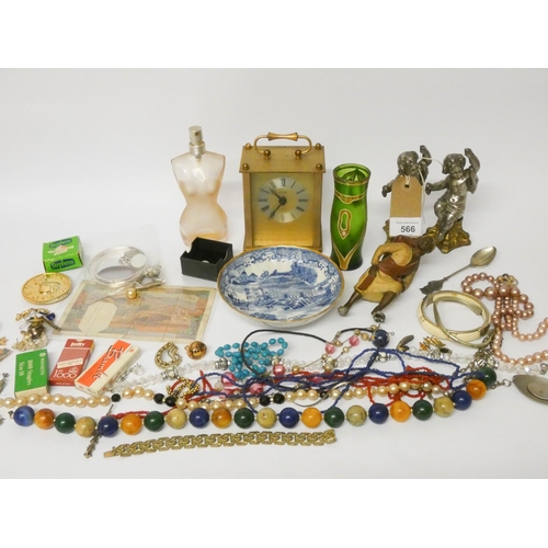 566 - Various small figure ornaments, mantle clock, odd pieces of jewellery, bank note etc