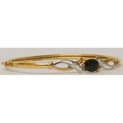 598 - 9ct yellow gold modern sapphire and diamond set bangle. 4.1 grams