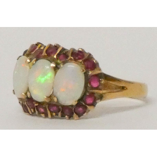 612 - A large three stone opal and ruby triple cluster ring, 9ct yellow gold shank, size N