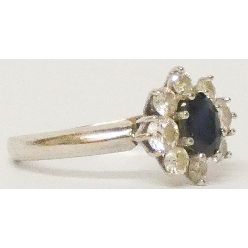 633 - 18ct white gold sapphire and diamond cluster ring, hallmarked, ring size M