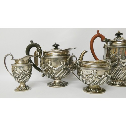 574 - Late Victorian embossed five piece silver tea set, London 1896, by Holland, Aldwinckle & Slater, wei... 