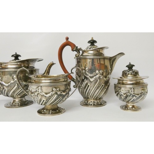 574 - Late Victorian embossed five piece silver tea set, London 1896, by Holland, Aldwinckle & Slater, wei... 