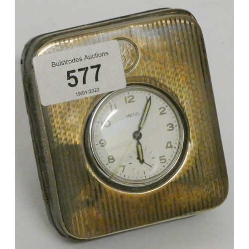 577 - A small Smith's silver mounted travelling clock