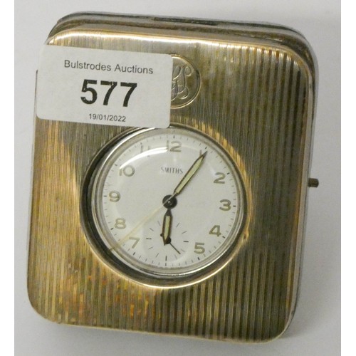 577 - A small Smith's silver mounted travelling clock