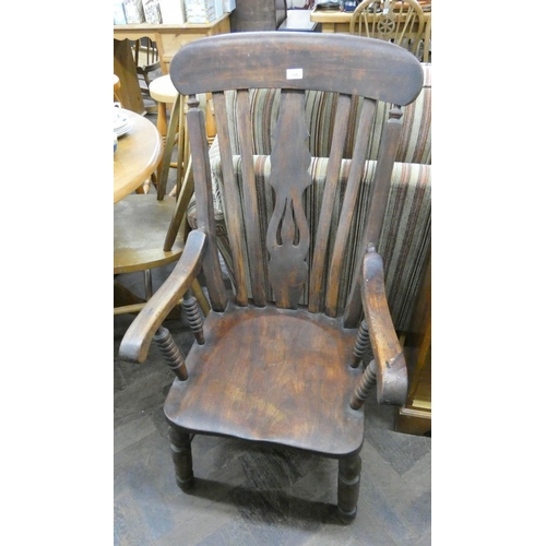 108 - A high slat back Windsor elbow chair with bobbin turned columns