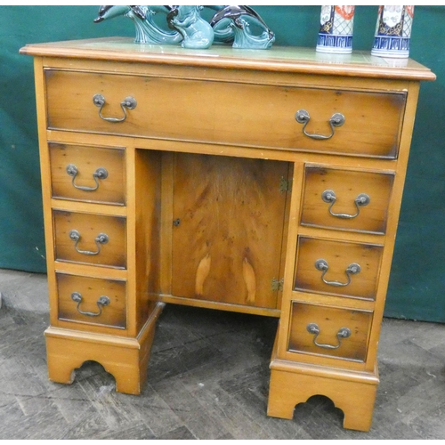 197 - Georgian style yew wood kneehole desk, fitted seven drawers and centre cupboard with green leather t... 