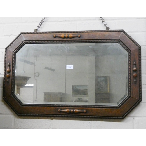 206 - Bevelled wall mirror in oak frame