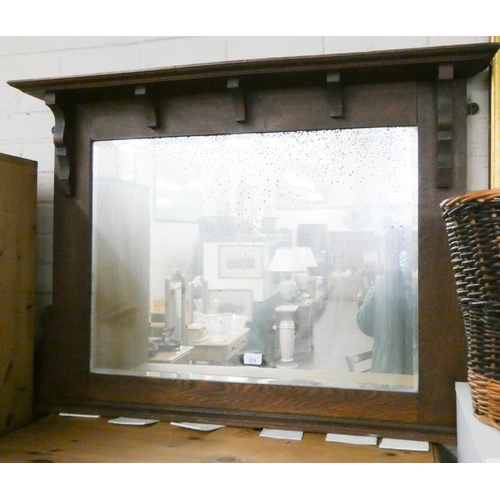 214 - Bevelled over mantle mirror in oak frame