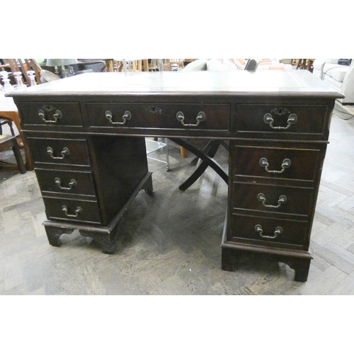 259 - Georgian style mahogany twin pedestal desk, fitted nine drawers with green leather top, 4' wide