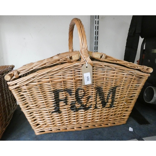 384 - A Fortnum & Mason wicker picnic basket with double lift top lid