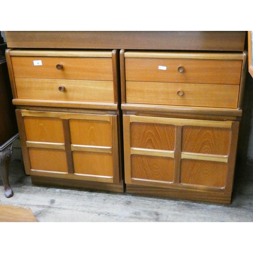 46 - A pair of teak bedside cabinets each fitted two drawers