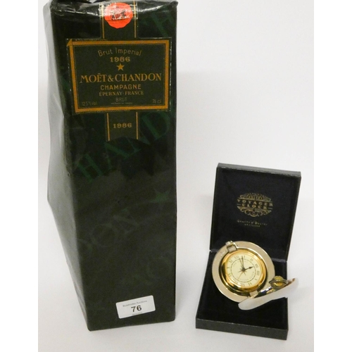 76 - A bottle of Moet Chandon Champagne 1986 and a small Voyager travelling clock