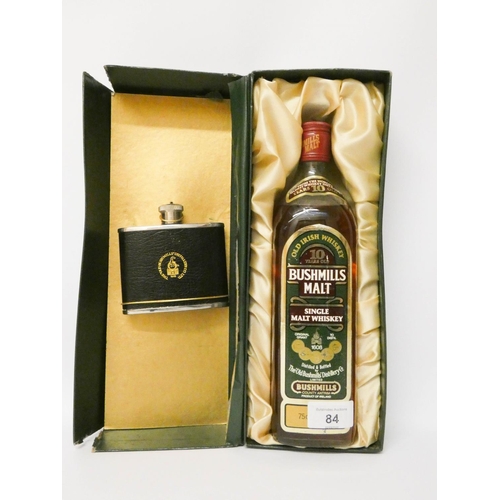 84 - A bottle of 10 year old Bushmills single malt whisky together with a pocket flask