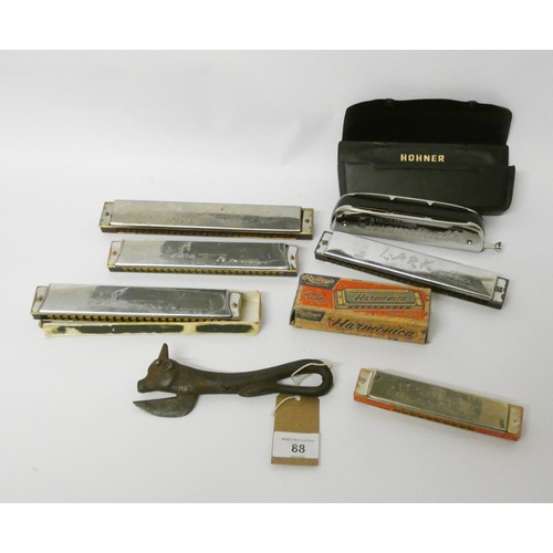 88 - Assorted harmonicas and mouth organs and an old tin opener