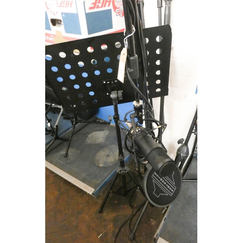 452 - Four professional microphone stands and a music stand