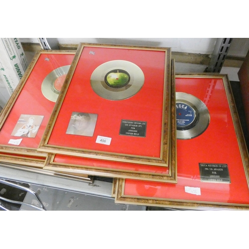 456 - Approximately seven gold, platinum, silver wall hanging record discs