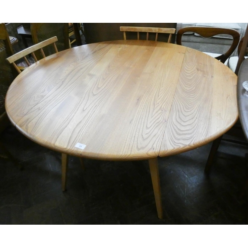 55 - An Ercol blond elm circular drop leaf dining table, 3'9 diameter