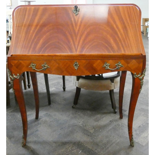 60 - A French style mahogany bureau fitted one drawer standing on cabriole style legs with gilt metal mou... 