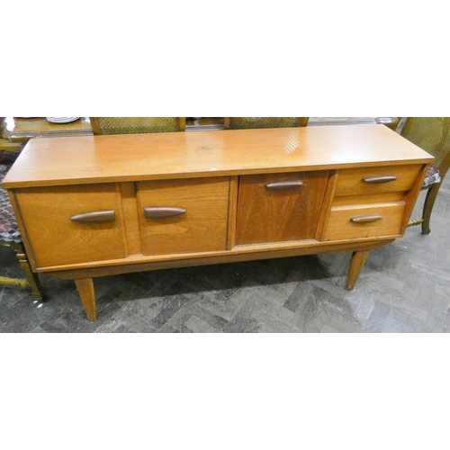 70 - A long low teak sideboard, fitted cupboards, drawers and pull down flap, 5'6 wide