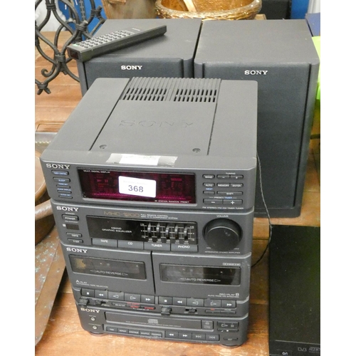 323 - Small Sony stacking music system, containing CD player, tapes, radio etc, with two speakers and remo... 