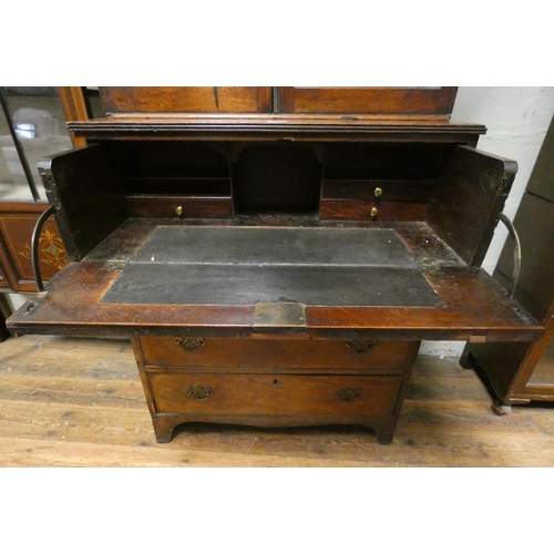 243 - A Victorian mahogany secretaire bookcase, lattice glazed two door bookcase standing on a secretaire ... 