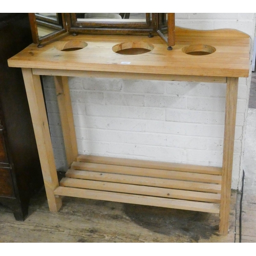 245 - A two tier pine kitchen table with holes for pans