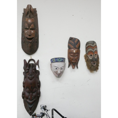 313 - Five assorted African and oriental masks