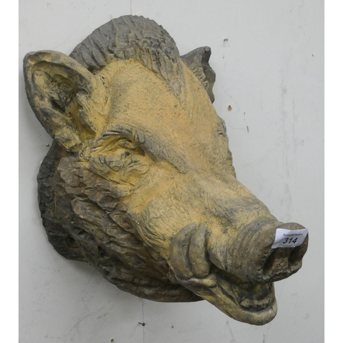 314 - A heavy reconstituted stone wall hanging boars head