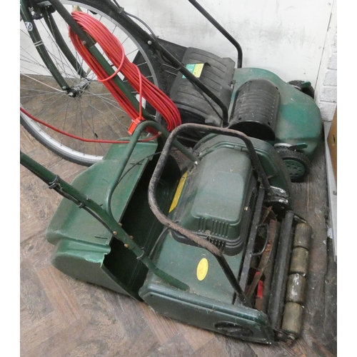 317 - An electric cylinder lawnmower with roller and an electric scarifier